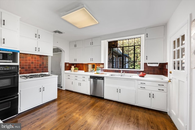 kitchen with a sink, visible vents, dishwasher, and light countertops