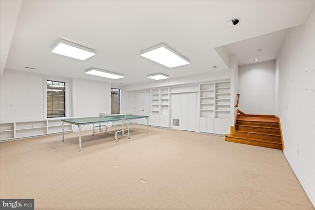 rec room with visible vents, baseboards, and carpet floors