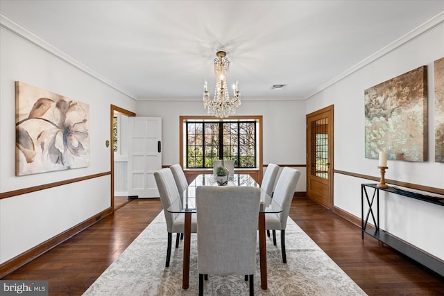 dining room with dark wood-style floors, visible vents, baseboards, an inviting chandelier, and ornamental molding