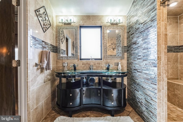 bathroom featuring tile patterned floors, tile walls, and vanity