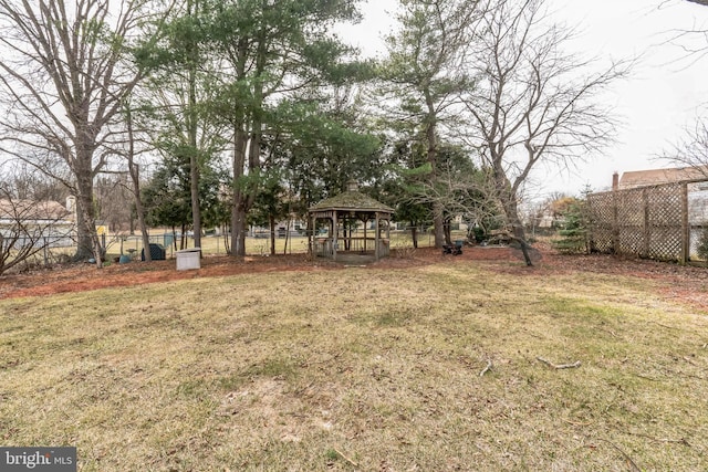 view of yard with a gazebo and fence