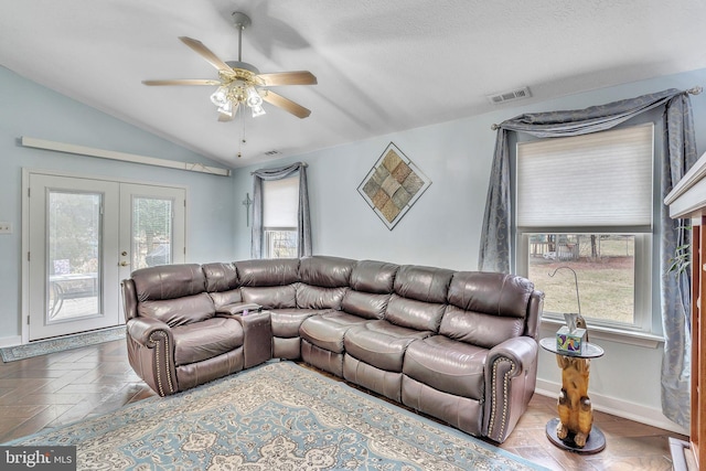 living area with a ceiling fan, visible vents, baseboards, lofted ceiling, and french doors