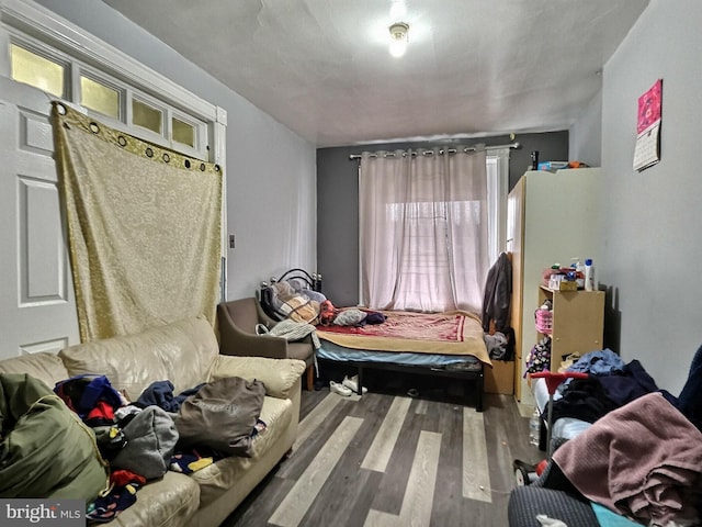 bedroom with wood finished floors