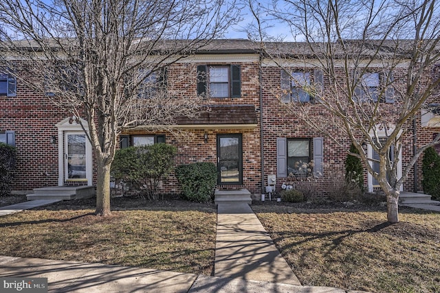 view of property with brick siding