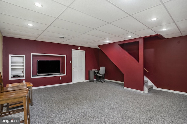 interior space featuring built in shelves, recessed lighting, carpet flooring, baseboards, and stairs