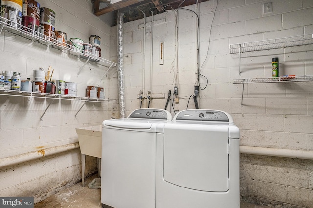 washroom featuring washer and dryer and laundry area