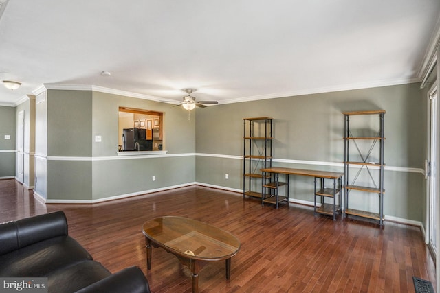 living room featuring visible vents, baseboards, ceiling fan, and wood finished floors