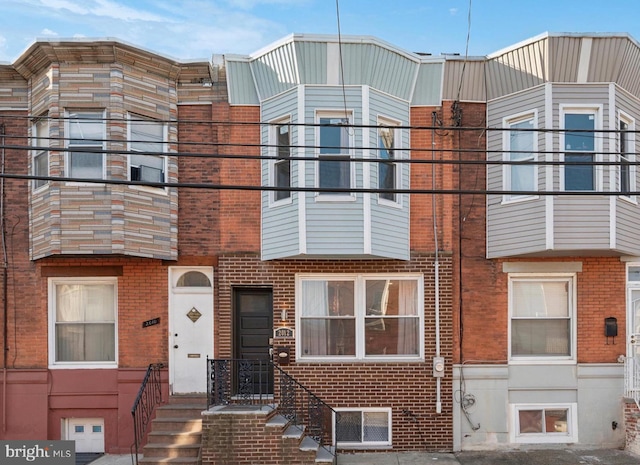 multi unit property featuring brick siding