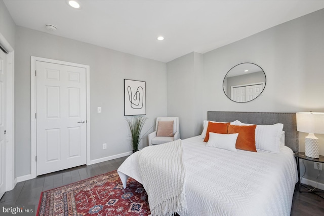 bedroom with recessed lighting, baseboards, and wood finished floors