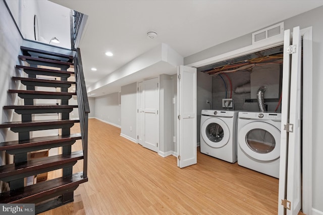 laundry room featuring visible vents, laundry area, recessed lighting, light wood-style floors, and washer and dryer