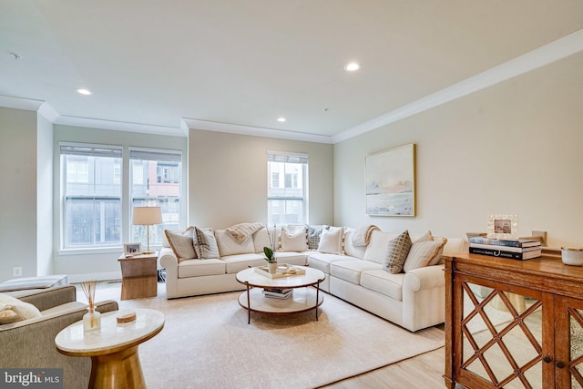 living area featuring recessed lighting, crown molding, and wood finished floors