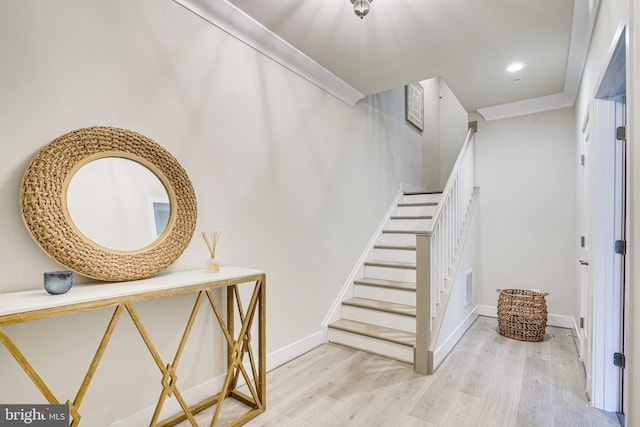 stairs with visible vents, recessed lighting, baseboards, and wood finished floors