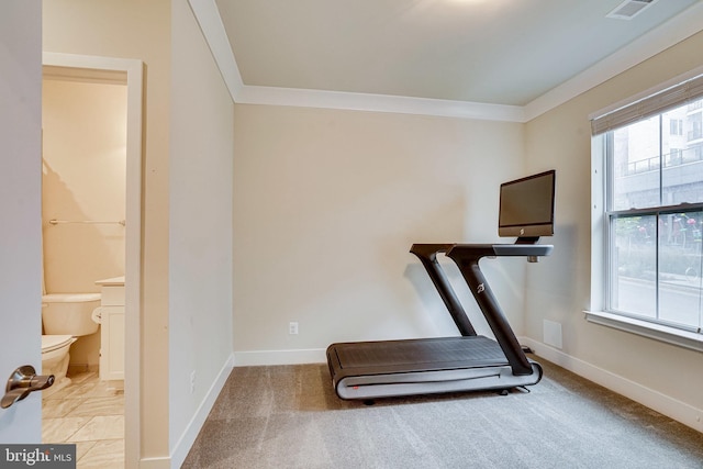 workout area featuring visible vents, baseboards, and ornamental molding