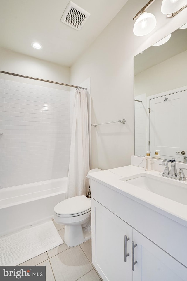 bathroom featuring visible vents, toilet, shower / bath combination with curtain, tile patterned flooring, and vanity