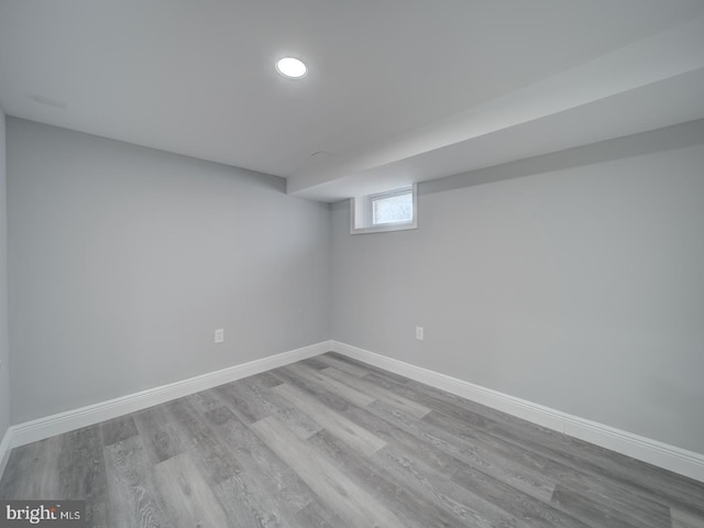 basement with wood finished floors and baseboards