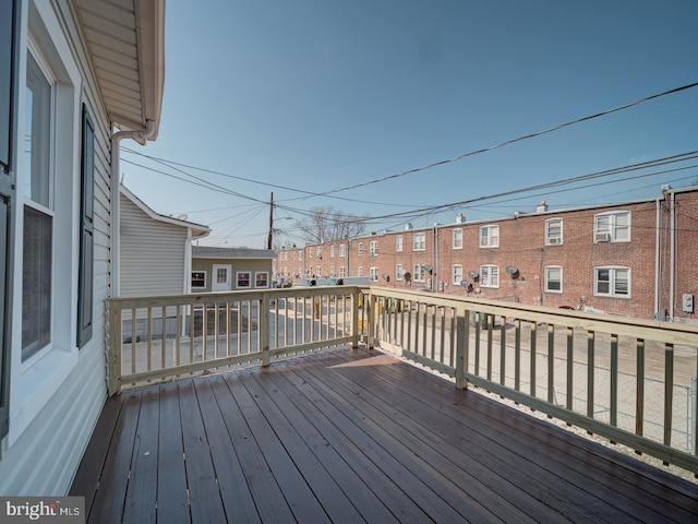 wooden deck with a residential view