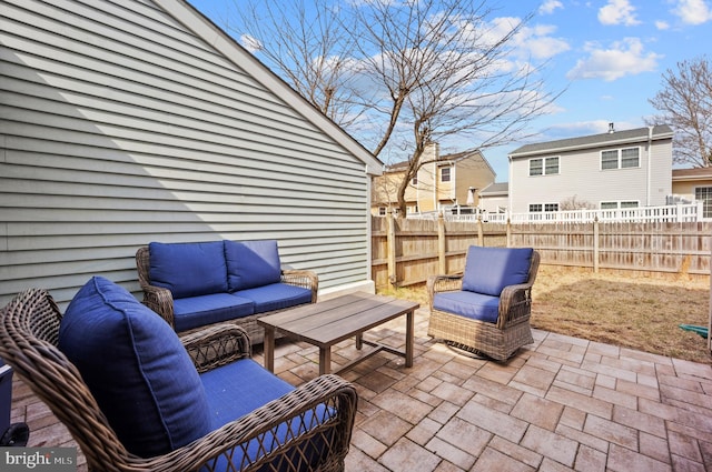 view of patio / terrace featuring outdoor lounge area and fence