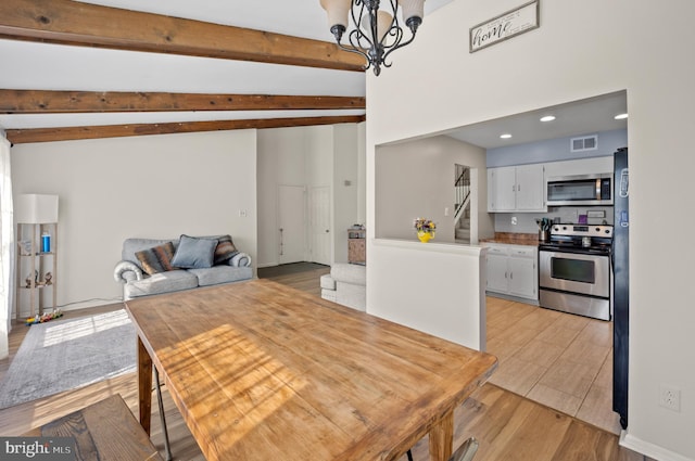 dining room featuring stairway, visible vents, light wood-style floors, beamed ceiling, and a notable chandelier