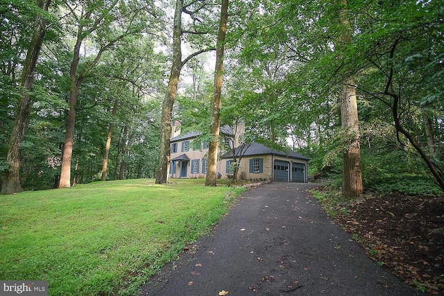 view of front of house with a front lawn and driveway