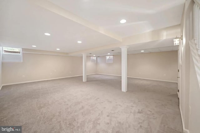 below grade area with recessed lighting, baseboards, and carpet flooring