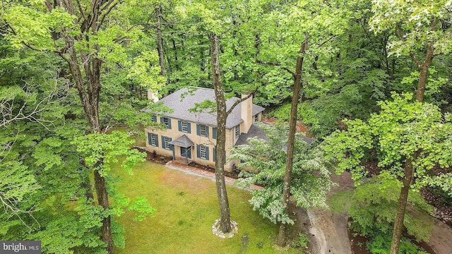 aerial view featuring a view of trees