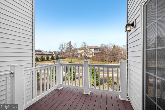 wooden deck with a residential view