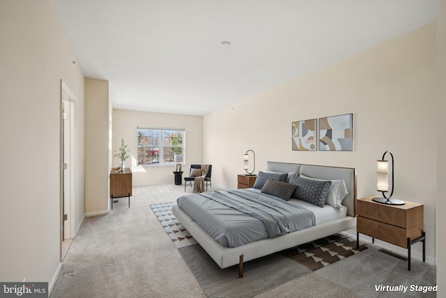 bedroom with carpet flooring and baseboards