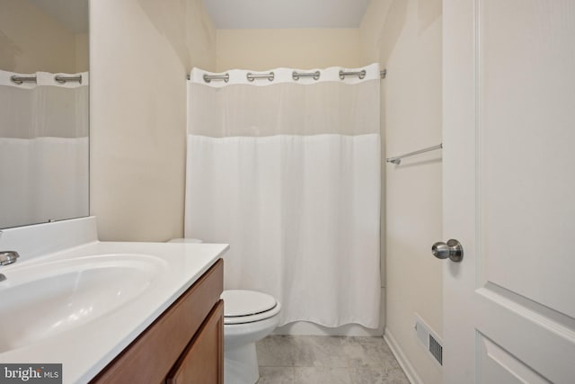 full bathroom with vanity, toilet, and visible vents