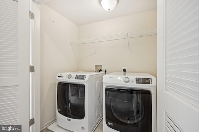 washroom with laundry area and washer and clothes dryer