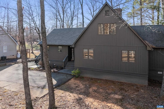 view of property exterior featuring roof with shingles