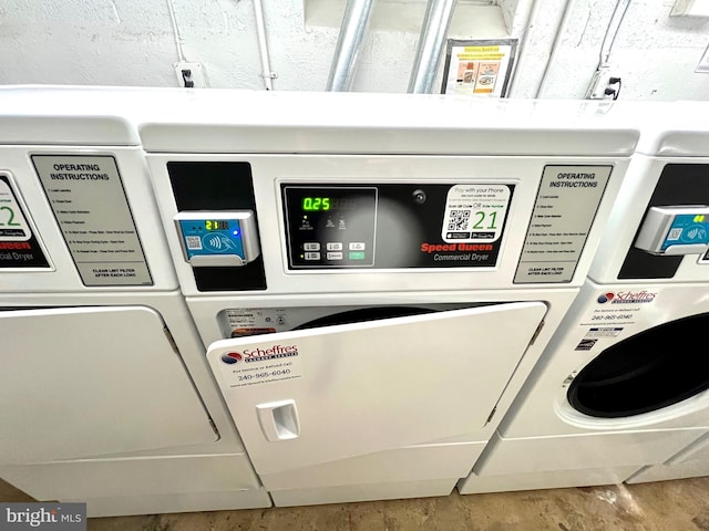 washroom featuring washer / clothes dryer and wood finished floors