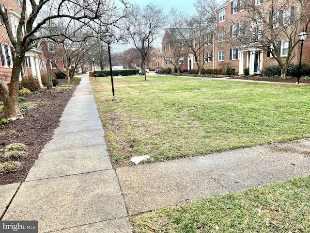 view of community with a residential view and a lawn