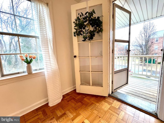 entryway with baseboards and a wealth of natural light