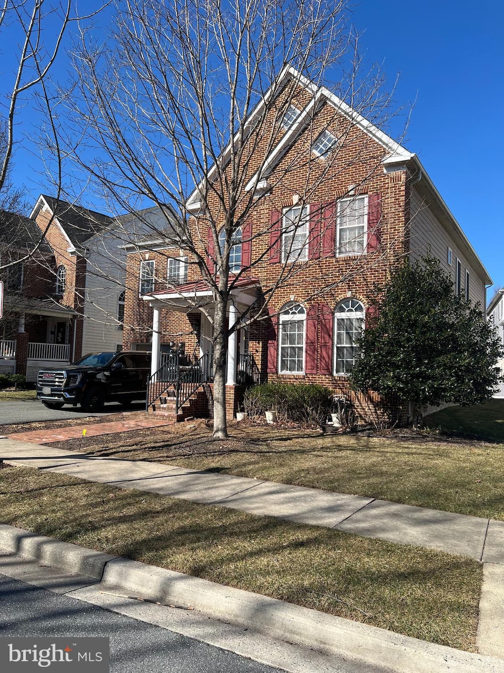 view of front of house with brick siding