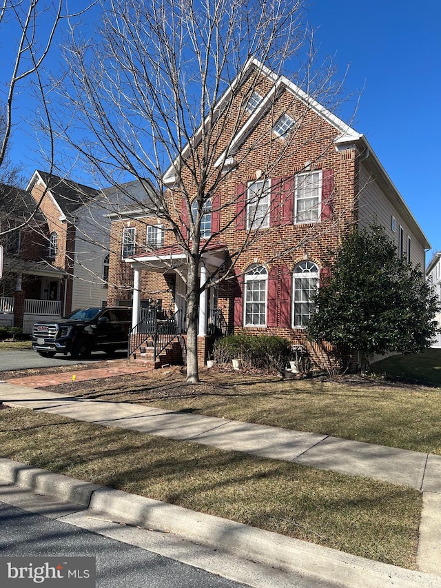 view of front of house with brick siding