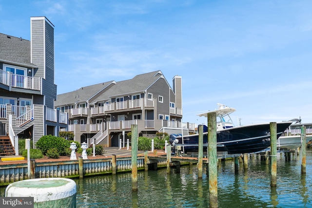 415 14th St Unit 55A, Ocean City, MD 21842 - back of house with boat lift, a water view, and stairway