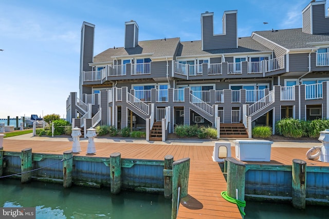 415 14th St Unit 55A, Ocean City, MD 21842 - rear view of house with a water view, a chimney, and stairway