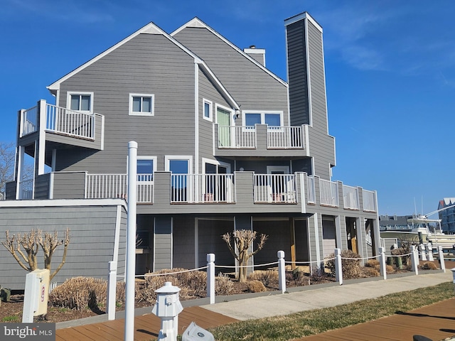 rear view of property with fence