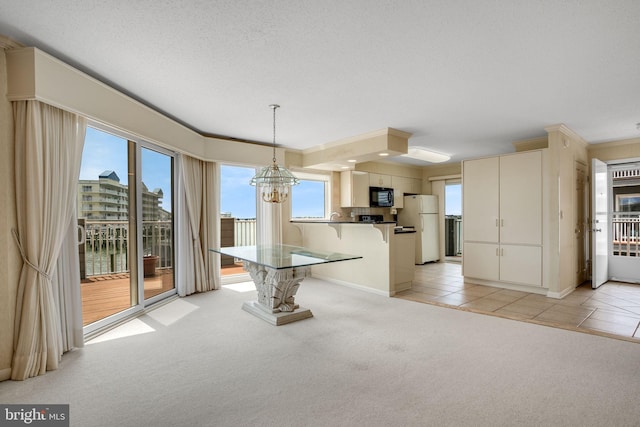 415 14th St Unit 55A, Ocean City, MD 21842 - unfurnished dining area featuring light colored carpet, a chandelier, and light tile patterned floors