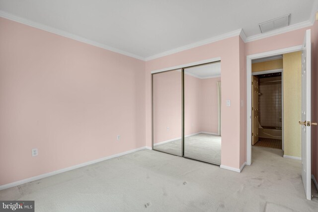 415 14th St Unit 55A, Ocean City, MD 21842 - unfurnished bedroom featuring carpet floors, ornamental molding, baseboards, and a closet