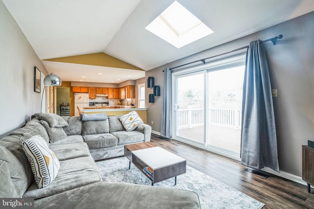 living area with baseboards, visible vents, recessed lighting, dark wood-type flooring, and lofted ceiling with skylight