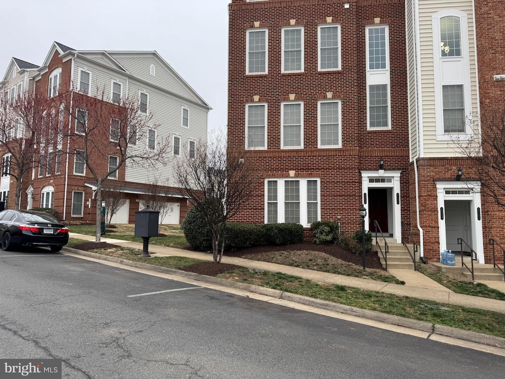 view of property featuring brick siding