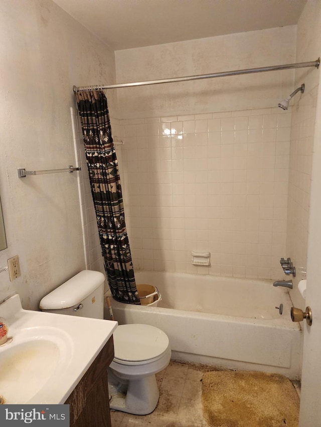 bathroom with vanity, tile patterned floors, toilet, and shower / tub combo with curtain