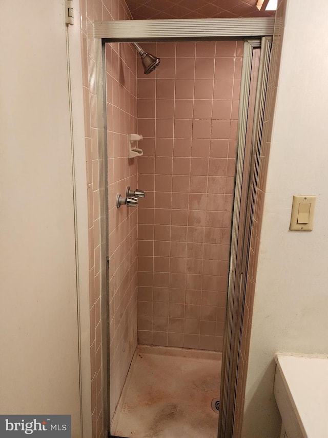 full bath featuring a shower stall