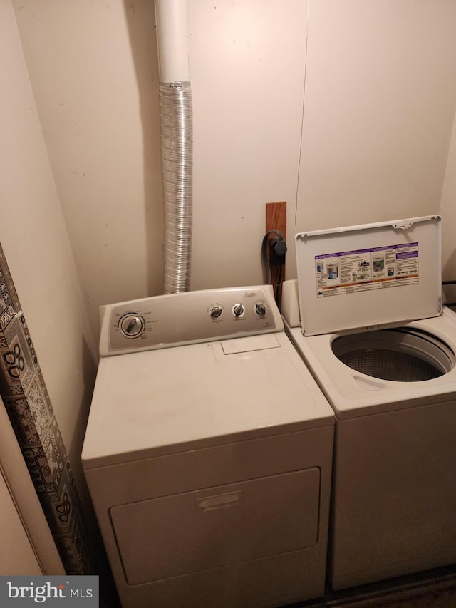 laundry room with washing machine and dryer and laundry area