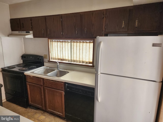 kitchen featuring under cabinet range hood, dark brown cabinetry, light countertops, black appliances, and a sink