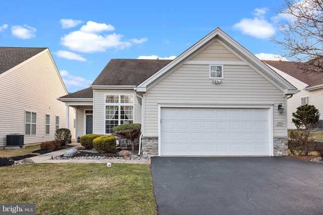 view of front of home featuring aphalt driveway, stone siding, a shingled roof, a garage, and central AC unit