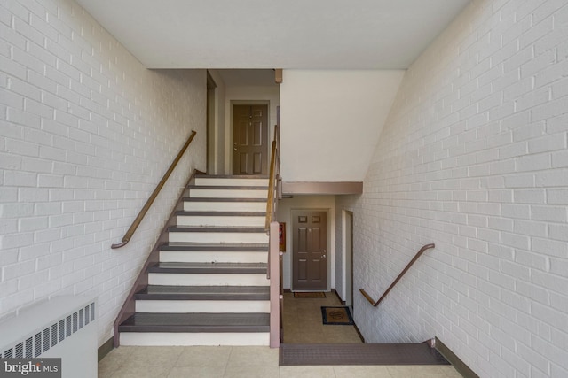 staircase featuring radiator