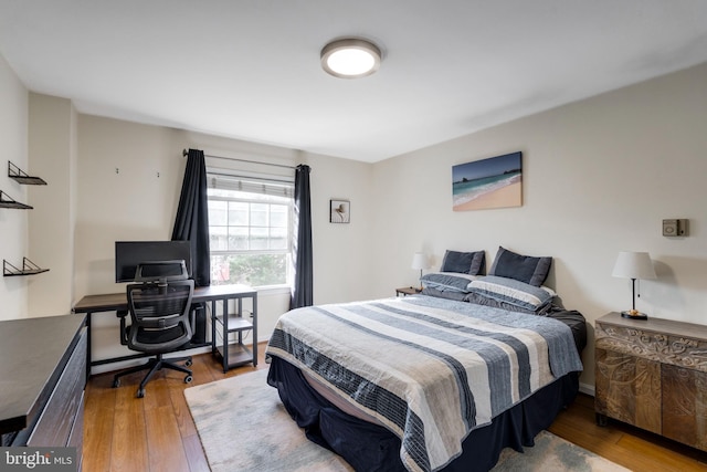 bedroom with hardwood / wood-style flooring