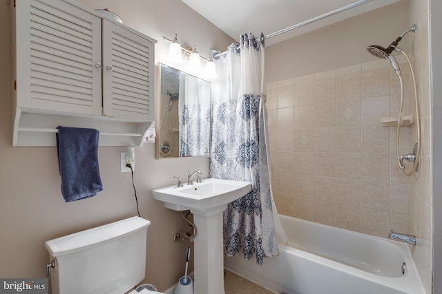 bathroom featuring toilet and shower / bathtub combination with curtain